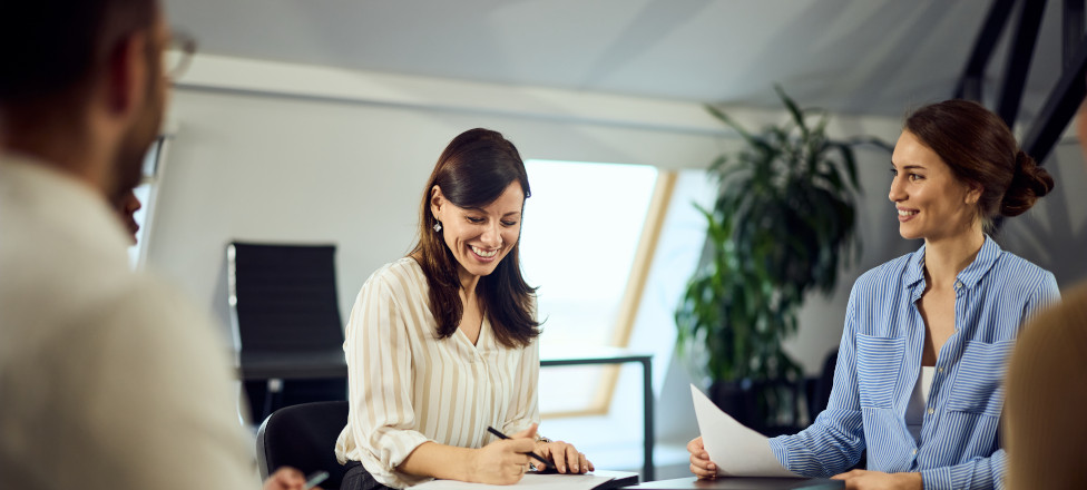 Group of businesspeople sitting in a circle and having psychotherapy.