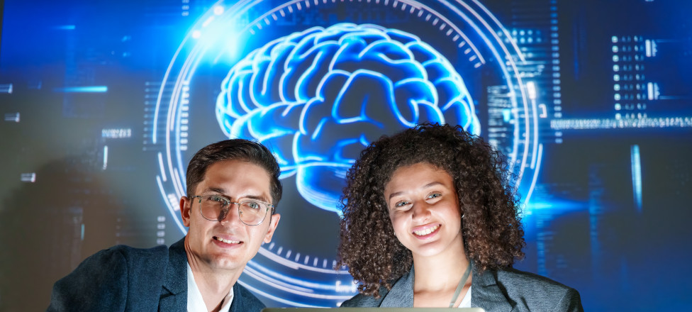 Team presenting innovative technology ideas in a modern office setting with AI technology